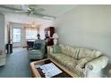 Living Room with sofa, recliner, and coffee table at 5906 Garden Ln # A22, Bradenton, FL 34207