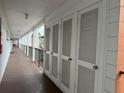 Hallway view with storage units at 5906 Garden Ln # A22, Bradenton, FL 34207