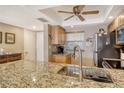 Kitchen with granite countertops and modern appliances at 1300 N Portofino Dr # 305, Sarasota, FL 34242