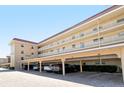 Parking garage with covered parking spaces at 1300 N Portofino Dr # 305, Sarasota, FL 34242