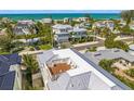 Private rooftop deck with seating, offering scenic ocean views at 404 North Shore Dr, Anna Maria, FL 34216