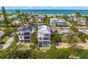 Aerial view of a luxury home near the ocean, showcasing its unique design and prime location at 404 North Shore Dr, Anna Maria, FL 34216