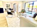 Living room with comfortable seating, creating a relaxing space at 5408 Swift Rd # 28, Sarasota, FL 34231