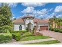 Luxury home with a two-car garage and well manicured landscaping at 7336 Haddington Cv, Bradenton, FL 34202
