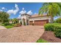 Stunning curb appeal, two-car garage, and beautifully landscaped yard at 7336 Haddington Cv, Bradenton, FL 34202