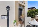View of condo entrance with address marker and landscaping at 1712 Lakeside Dr # 1712B, Venice, FL 34293