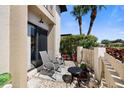 Private condo patio with seating for relaxing at 1712 Lakeside Dr # 1712B, Venice, FL 34293