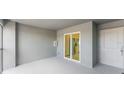 Covered patio with sliding glass doors leading to the kitchen at 12520 Galapagos Ct # 207, Venice, FL 34293