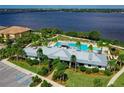 Community clubhouse and pool with waterfront views at 1020 Tidewater Shores Loop # 108, Bradenton, FL 34208
