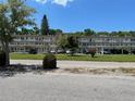 Front view of condo building showcasing its architecture and landscaping at 4480 Ironwood Cir # 308A, Bradenton, FL 34209