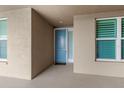 Private condo entrance with light blue door and neutral color scheme at 10520 Boardwalk Loop # 302, Bradenton, FL 34202