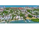Aerial view of waterfront community with lush landscaping and beautiful homes at 6157 Midnight Pass Rd # E24, Sarasota, FL 34242