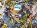 Bird's-eye view of a home with pool and spacious deck at 7147 La Lenaire Dr, Longboat Key, FL 34228