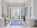 Elegant entryway with double doors and tile flooring at 4811 Cabreo Ct, Lakewood Ranch, FL 34211