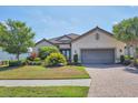 One-story home with landscaped yard at 4811 Cabreo Ct, Lakewood Ranch, FL 34211