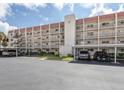 Condo building exterior with parking and landscaping at 220 Santa Maria St # 240, Venice, FL 34285