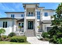 Modern two-story home with stone accents and water features at 121 Seagull Ln, Sarasota, FL 34236