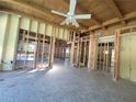 Spacious living room showcasing exposed framing, offering a glimpse into the renovation potential at 8010 Marina Dr, Holmes Beach, FL 34217