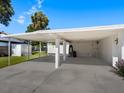 Covered carport with extra storage space at 215 Jessica N St, Nokomis, FL 34275