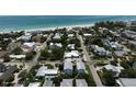 Picturesque coastal neighborhood and location of blue home near white sand beach at 4805 2Nd Ave, Holmes Beach, FL 34217