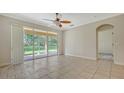 Bright living room with tile floors and sliding doors at 11415 52Nd E Ct, Parrish, FL 34219