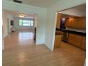 Bright entryway showing views of the living room and kitchen at 2501 Beneva Rd # 8, Sarasota, FL 34232