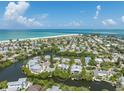 Aerial view of waterfront property with canal at 108 Tern Dr, Anna Maria, FL 34216