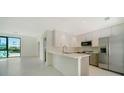Open concept kitchen, showcasing contemporary cabinets and a breakfast bar at 1558 4Th St # 210, Sarasota, FL 34236
