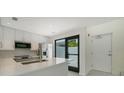 Modern kitchen with stainless steel appliances and white quartz countertops at 1558 4Th St # 210, Sarasota, FL 34236