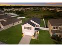 Two-story house with gray siding and a backyard at 335 Gris Sky Ln, Bradenton, FL 34212