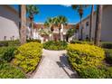 Building exterior showcasing a well-maintained courtyard with a fountain and walkway at 4244 Central Sarasota Pkwy # 725, Sarasota, FL 34238