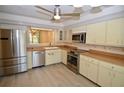 Modern kitchen with stainless steel appliances and light wood floors at 6101 34Th W St # 1E, Bradenton, FL 34210