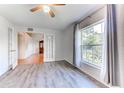 Bright bedroom featuring hardwood floors and large window at 4005 Belladonna Ave, North Port, FL 34286