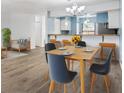 Light-filled dining area with modern furnishings and hardwood flooring, adjacent to the kitchen at 5412 11Th Street E Cir # 41, Bradenton, FL 34203