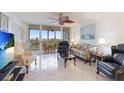 Spacious living room with balcony access at 4570 Pinebrook Cir # 603, Bradenton, FL 34209