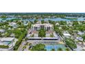 Aerial view of community, tennis courts, and parking at 6157 Midnight Pass Rd # G11, Sarasota, FL 34242
