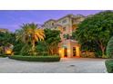 Elegant condo entrance with lush landscaping at 2151 Gulf Of Mexico Dr # 5, Longboat Key, FL 34228
