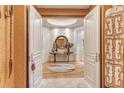 Elegant entryway with hardwood floors, decorative accents, and access to other rooms at 2151 Gulf Of Mexico Dr # 5, Longboat Key, FL 34228