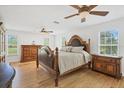 Spacious bedroom with hardwood floors and a large wooden bed frame at 3125 Pickett St, Port Charlotte, FL 33981