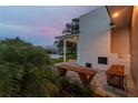 Relaxing patio with built-in fire pit and seating at 301 Aurora E St, Venice, FL 34285
