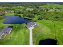 Luxury home with a large lot, lake views, and a private driveway at 3582 Recurve Cir, Sarasota, FL 34240