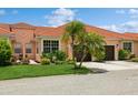 Front view of a two-story house with a two-car garage at 5635 Spanish Point Ct, Palmetto, FL 34221