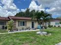Single story home with landscaping at 4540 Tippecanoe Trl # 183, Sarasota, FL 34233