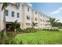 Townhomes with lush landscaping and a spacious lawn at 9966 Key Haven Rd, Seminole, FL 33777