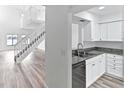Modern kitchen with granite countertops and stainless steel appliances at 2955 N Beach Rd # A531, Englewood, FL 34223