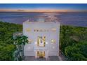 Modern waterfront home with sunset view at 5444 Gulf Of Mexico Dr, Longboat Key, FL 34228
