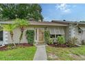 Ranch home with a walkway and lush landscaping at 773 N Jefferson Ave # 773, Sarasota, FL 34237