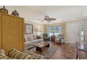 Living room featuring a sofa, chairs, and tiled floor at 773 N Jefferson Ave # 773, Sarasota, FL 34237