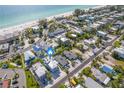 Aerial view of beach house near the ocean in a residential neighborhood at 2102 Avenue B, Bradenton Beach, FL 34217