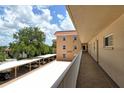 Condo building hallway and covered parking at 1350 N Portofino Dr # 310, Sarasota, FL 34242